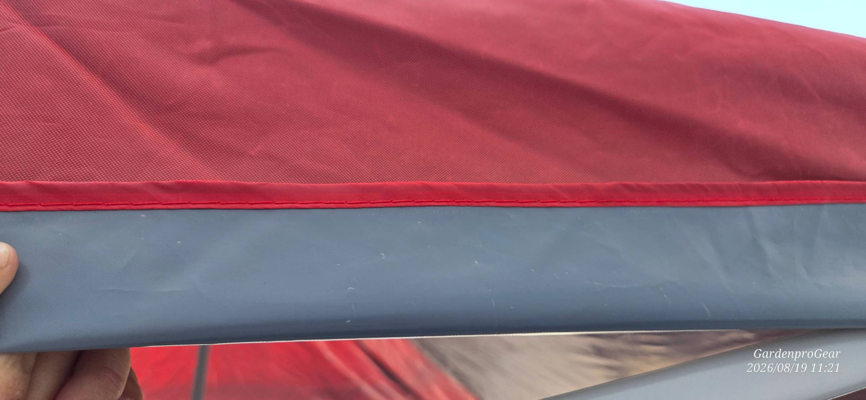 Close-up of GardenPro Gear red canopy fabric