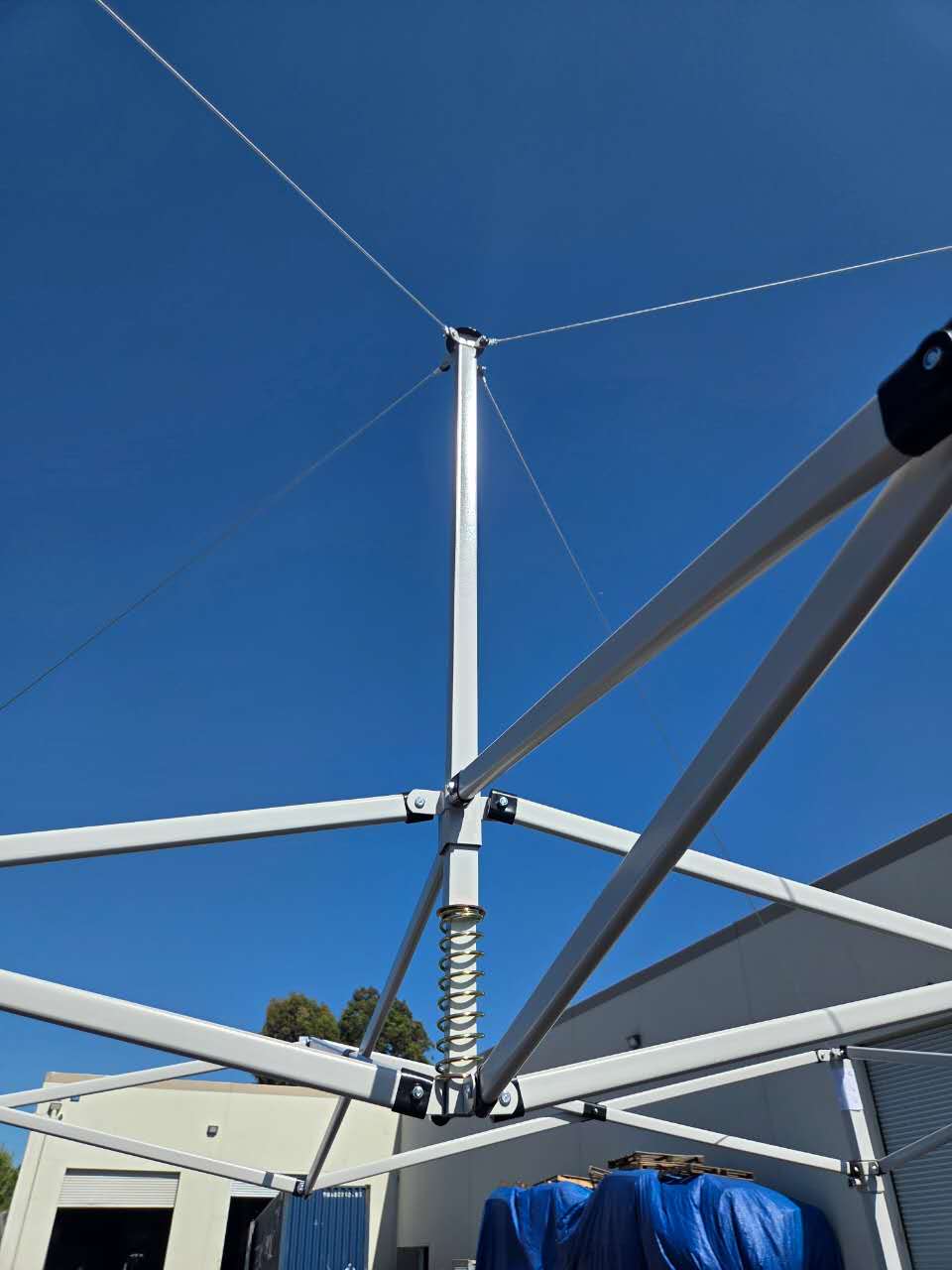 GardenPro Gear canopy frame and center pole under a blue sky